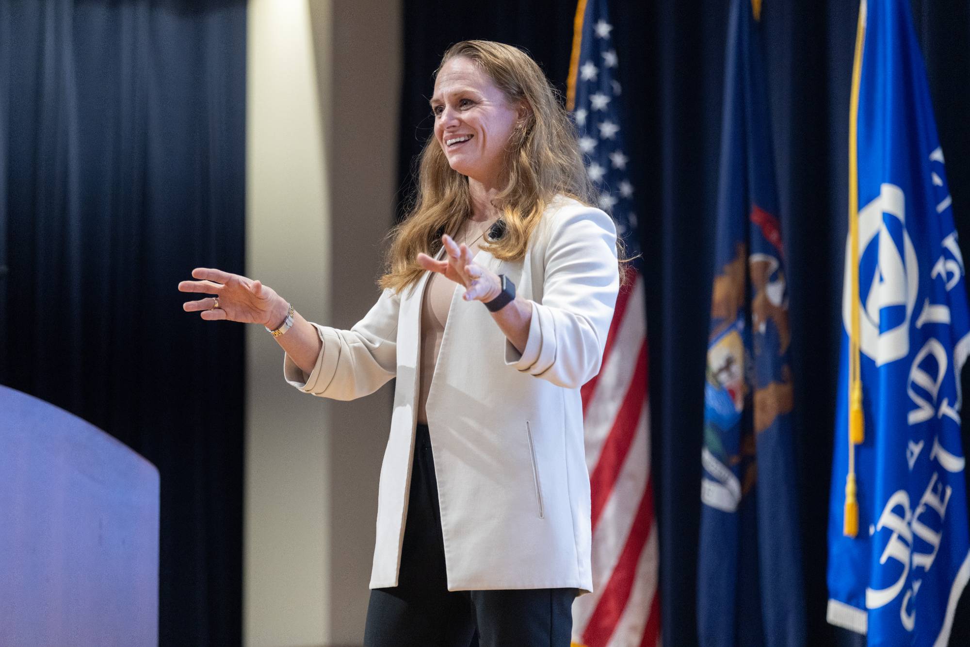 person speaking at a podium
